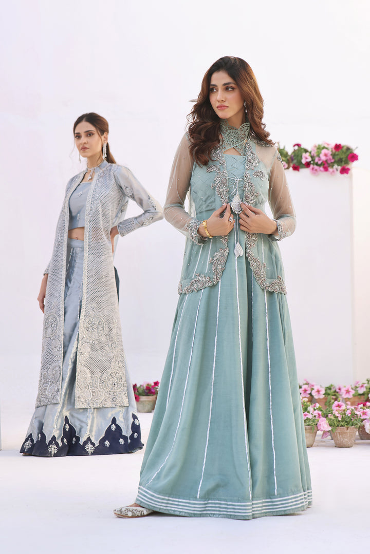  Dive into celestial allure with AASMANI This stunning ensemble features a kora net jacket adorned with exquisite diamante handwork and beauty.