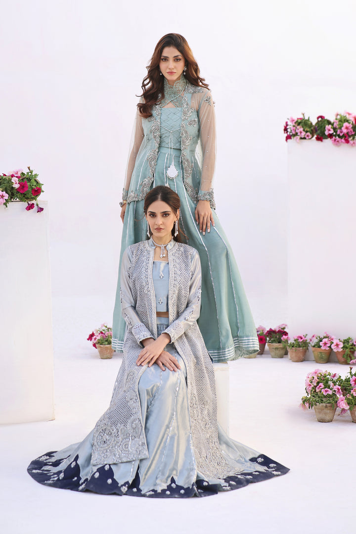  Dive into celestial allure with AASMANI This stunning ensemble features a kora net jacket adorned with exquisite diamante handwork and beauty.