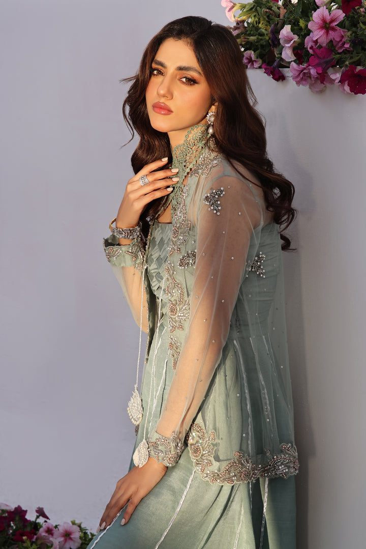  Dive into celestial allure with AASMANI This stunning ensemble features a kora net jacket adorned with exquisite diamante handwork and beauty.