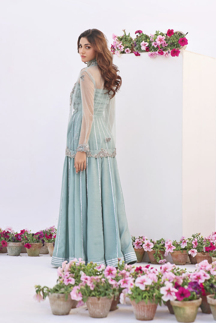  Dive into celestial allure with AASMANI This stunning ensemble features a kora net jacket adorned with exquisite diamante handwork and beauty.